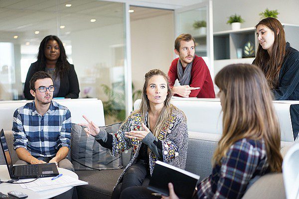 Woman explaining to a team