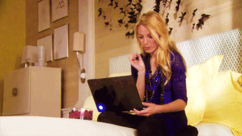 woman-eating-popcorn-with-laptop-on-lap-gif Woman eating popcorn with laptop on lap gif