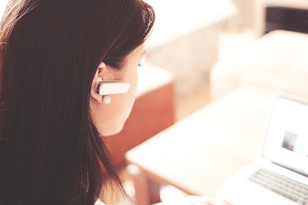 woman-with-bluetooth-ear-piece woman with bluetooth ear piece
